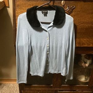Lovely light blue long sleeve shirt with a black fake fear collar, hardly worn.